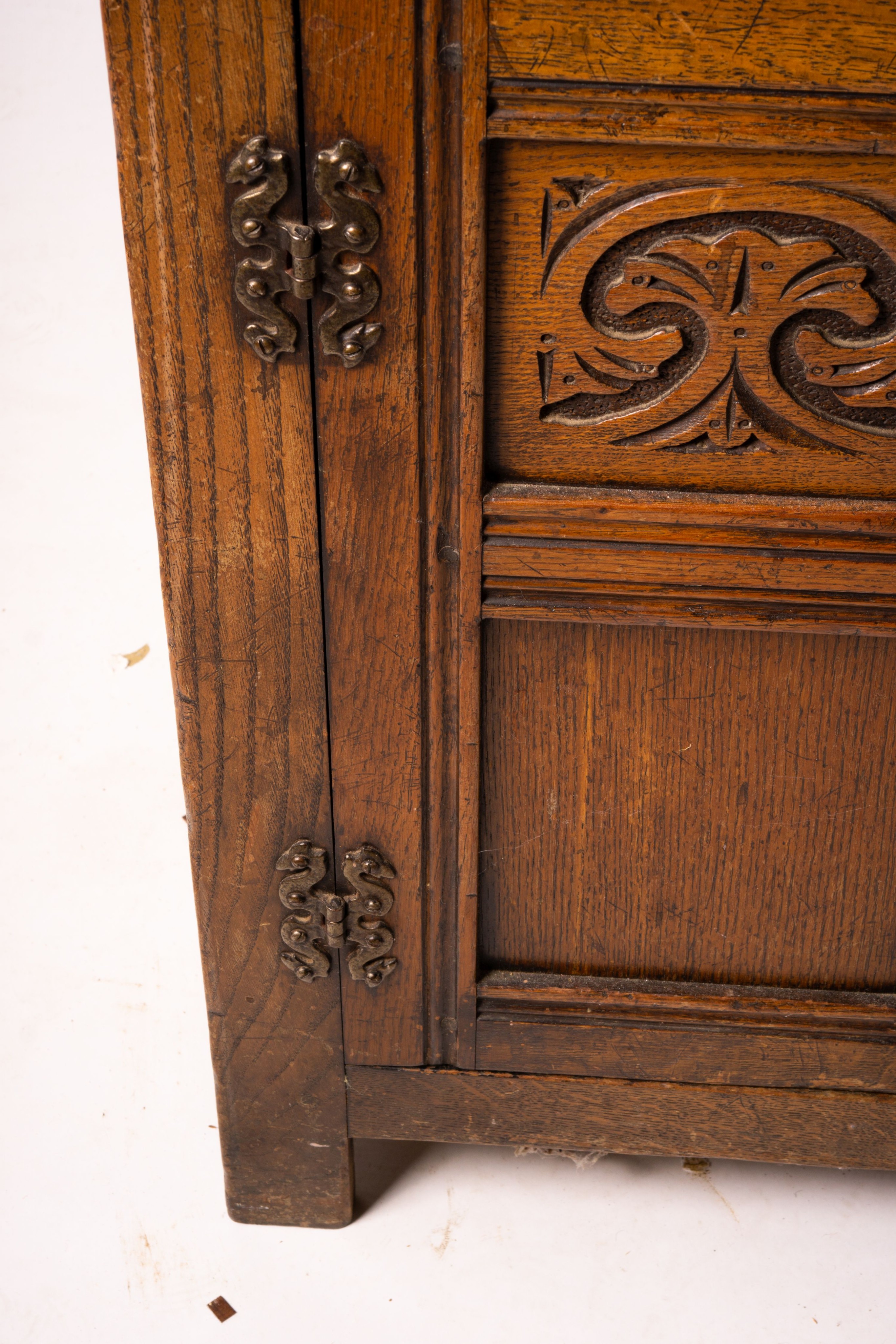 An 18th century style carved oak dresser, width 124cm, depth 46cm, height 175cm